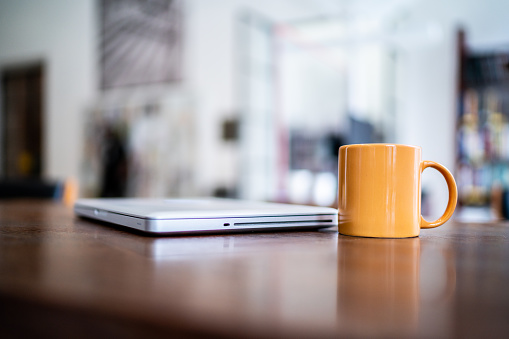 Laptop and mug on the desk