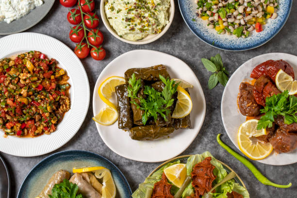 istock Top view traditional Turkish and Greek dinner appetizer table. Mediterranean appetizer concept. Raw meatballs, roasted eggplant salad, stuffed olives, stuffed peppers, gavurdagi salad 1448104233