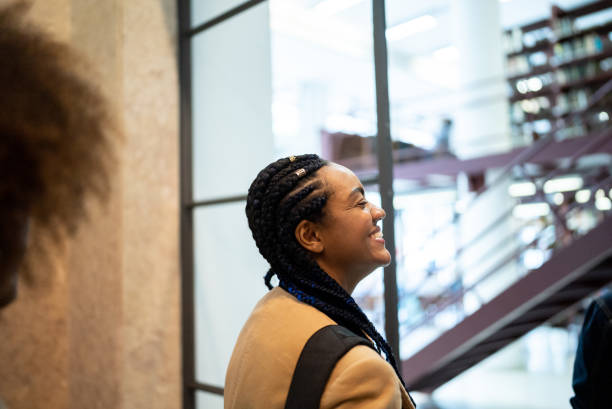 istock Young woman entering the library 1448105465