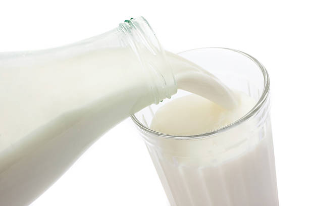 istock Fresh milk being poured into a glass 144810586
