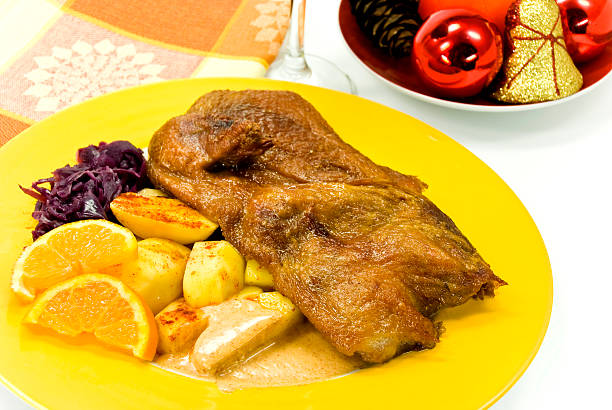 istock roasted christmas-duck with deep fried potatoes 144810866