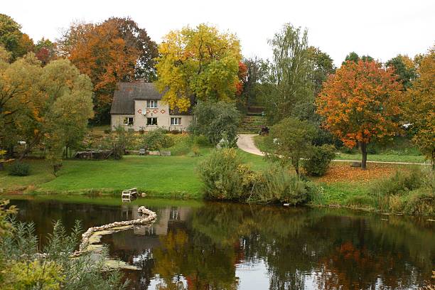 istock House on riverbank in autumn 144810871