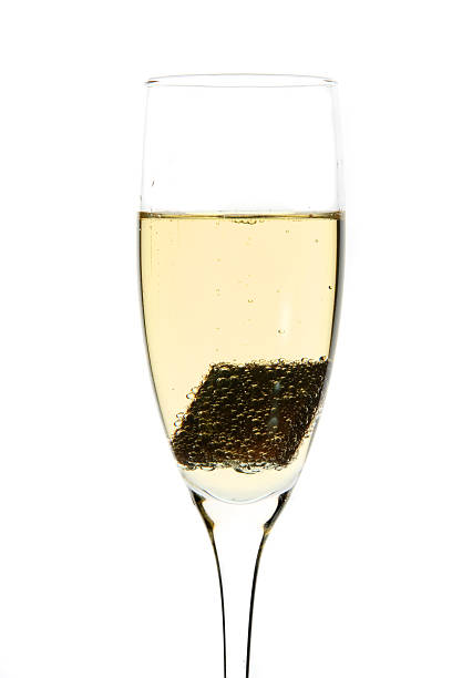 istock Glass of champagne with piece chocolate inside 144811579