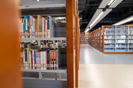 Bookcases on the aisle of the library in the University of Fujian Province, China