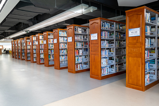 Bookcases on the aisle of the library in the University of Fujian Province, China