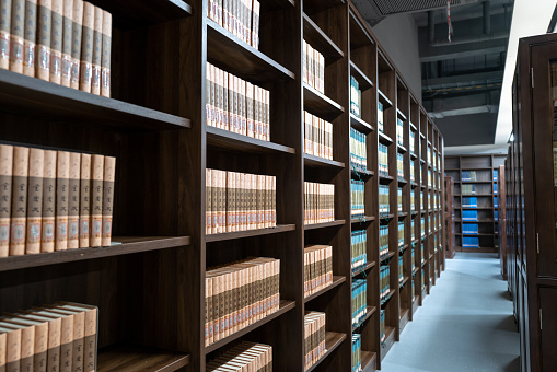 Bookcases on the aisle of the library in the University of Fujian Province, China