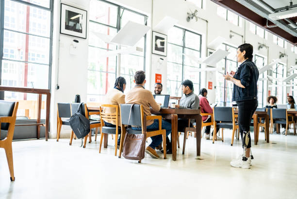 istock Friends studying in the library - including a transgender disabled person 1448117665