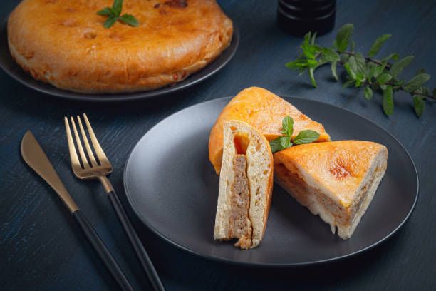 istock Chicken pie in a plate on a wooden table. 1448118105