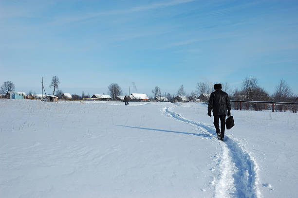 istock Man with a brief case, returning to his village 144811822