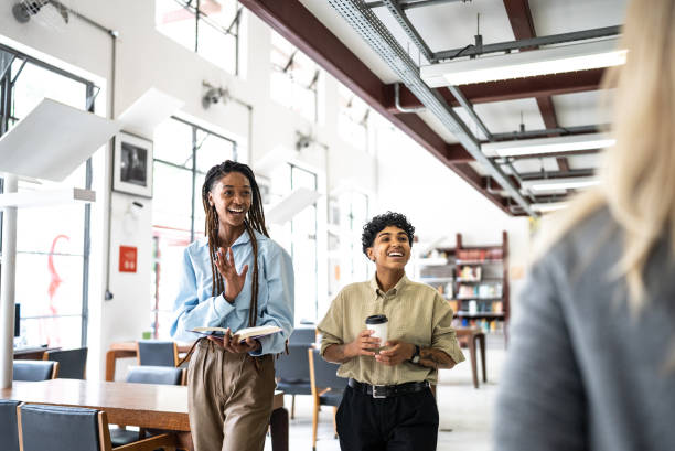 Friends greeting someone in the library