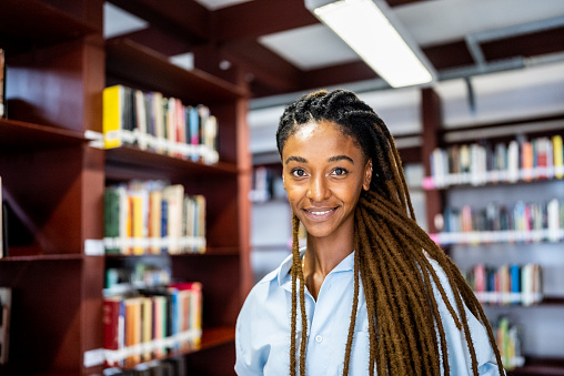 Portrait of a young woman in the library