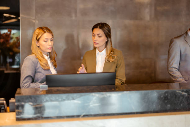 istock Hotel Manager Talking to Receptionists 1448123212