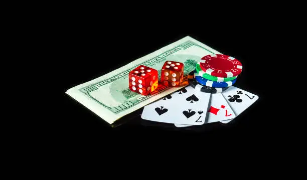 Set or three of a kind cards combination and dollars with chips. Winning combination at a poker club or casino