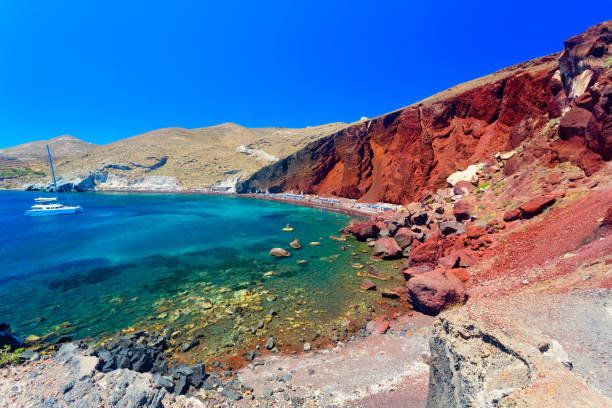 Woman exploring scenic Santorini island and looking at seaside during experiential trip to Greece