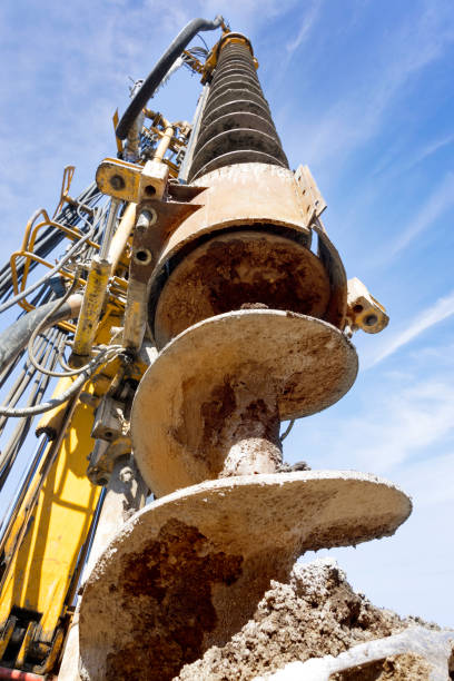 industrial drilling machine at the construction site - drill mining rock borehole imagens e fotografias de stock