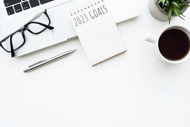 istock Notebook with 2023 goals text on it to apply new year resolutions and plan. 1448126596