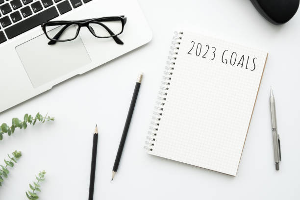 istock Notebook with 2023 goals text on it to apply new year resolutions and plan. 1448126615