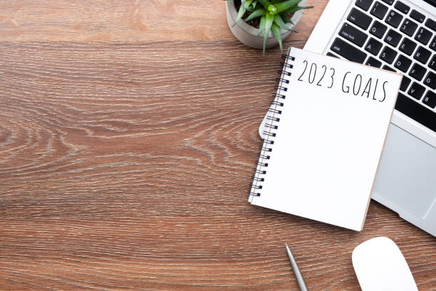 istock Notebook with 2023 goals text on it to apply new year resolutions and plan. 1448126681