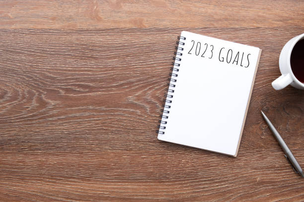 istock Notebook with 2023 goals text on it to apply new year resolutions and plan. 1448126682