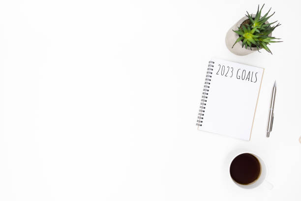 istock Notebook with 2023 goals text on it to apply new year resolutions and plan. 1448126754