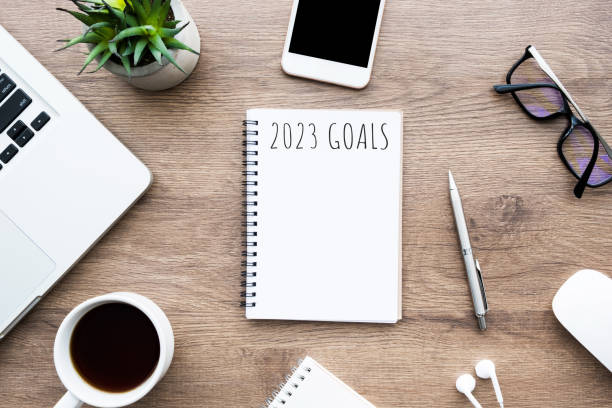 istock Notebook with 2023 goals text on it to apply new year resolutions and plan. 1448126755