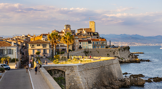 Antibes, France - August 4, 2022: Panoramic view of historic old town with medieval city walls and Picasso Museum onshore Azure Cost of Mediterranean Sea in Antibes resort town
