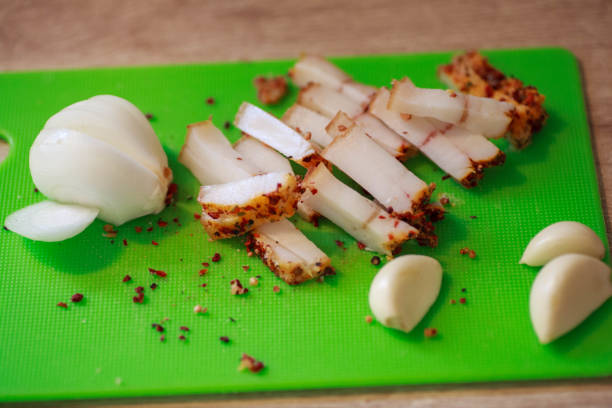 istock A piece of salted bacon on paper. 1448130268
