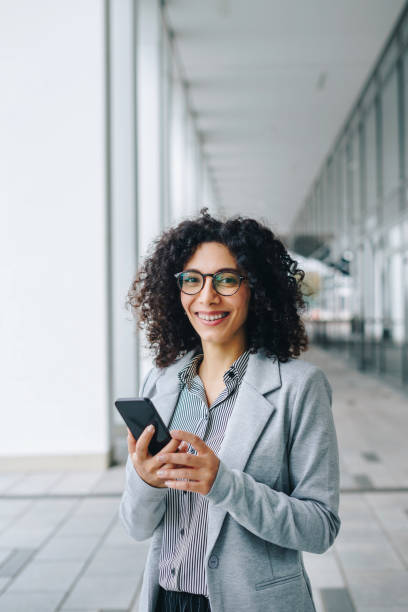 Business woman using smartphone stock photo