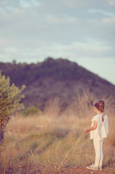 Littel angel girl at sunset