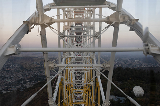 View from inside the Ferris wheel in the Mtatsminda park with Tbilisi on the background. Georgia