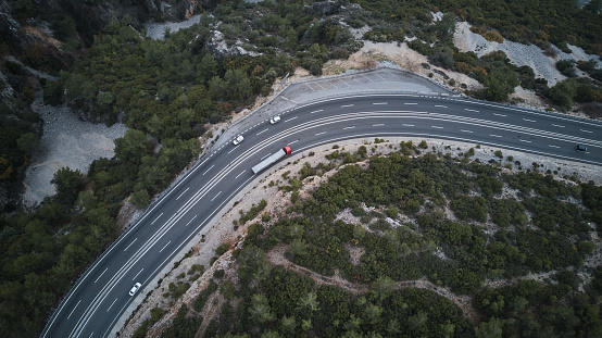 drone footage of mountain roads with winding roads