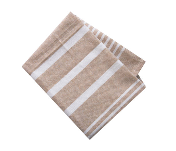 istock Kitchen towel isolated on white. Brown beige folded cloth.Food serving design element. 1448142493