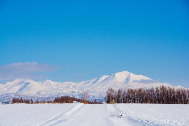 Winter hills and snowy mountains on a sunny day