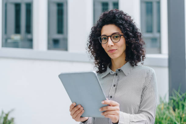 istock Businesswoman using digital tablet in the office 1448143511