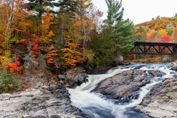Sainte Ursule Waterfall with fall colors in background . Canada.