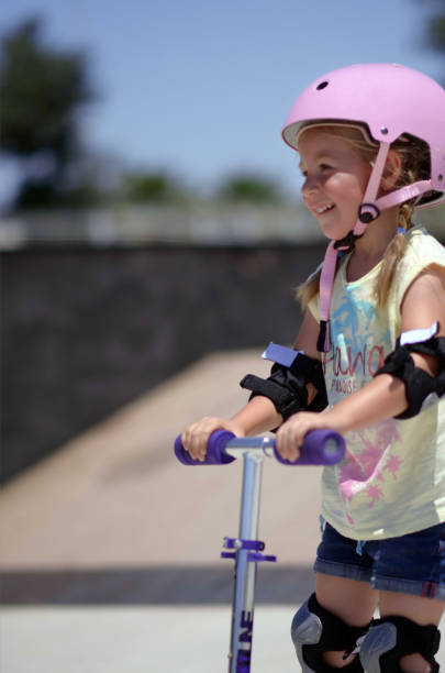 istock Little girl with scooter 1448150090