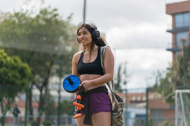 istock Sporty woman using phone 1448152444