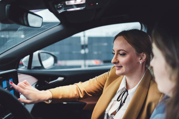 istock Woman in an electric car 1448152574