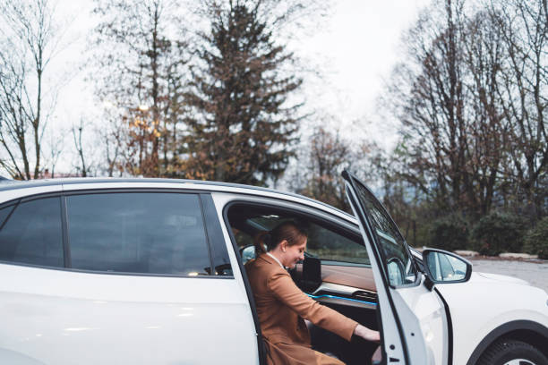 istock Woman is being picked up by car 1448152599