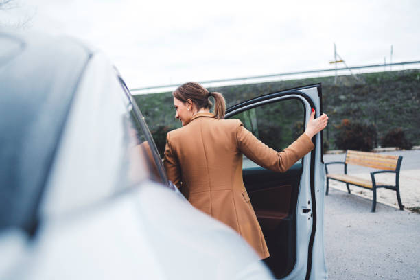 istock Woman is being picked up by car 1448152618