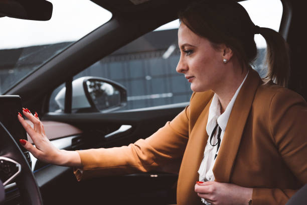 istock Woman in an electric car 1448152711