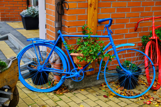Street decor two old bicycles are painted blue and red