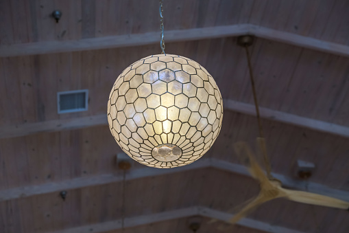 large globe sphere shell octagon beehive ceiling hanging light fixture.