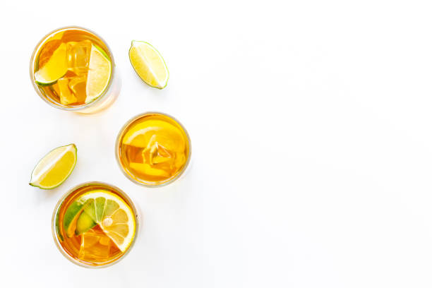 istock Alcoholic cocktails with oganges and ice in glasses. Alcoholic drinks background 1448154841