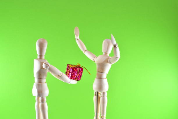 istock Dolls giving gifts 1448155052
