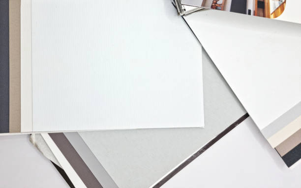 istock multicolored in white, grey, brown tone of fabric samples for ordering roller blinds. roller blinds drapery fabric catalogs for customer selection for home decoration. interior material samples chart. 1448155314