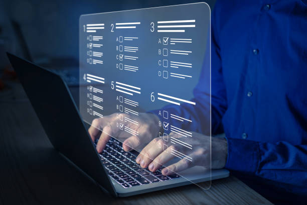 istock Online test, assessment or academic exam and answer multiple choice questions on computer screen. E-learning, remote student, survey, questionnaire, quiz on internet. MCQ. Person working on laptop. 1448156065