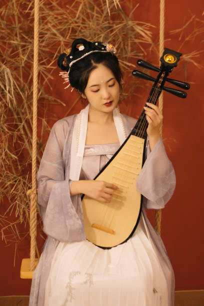 istock An Asian beauty plays the pipa on the swing 1448157409