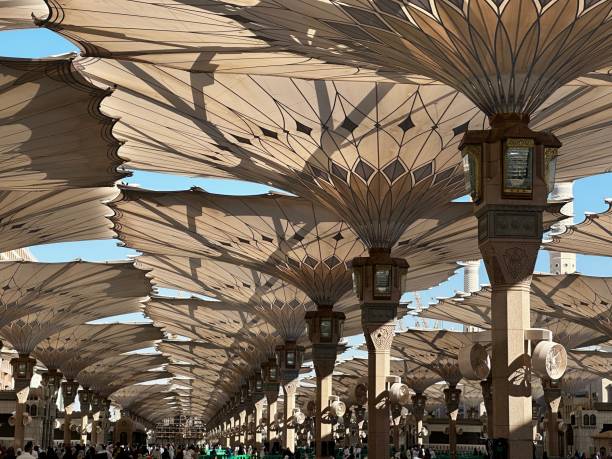 Nabawi mosque Nabawi mosque umbrella in the afternoon with beautiful shadow of sun al masjid an nabawi stock pictures, royalty-free photos & images