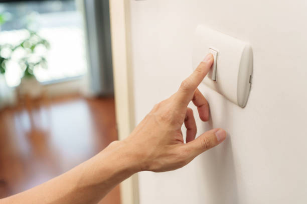 istock Closeup of finger is turning off on lighting switch 1448158470